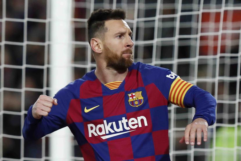 Lionel Messi celebra tras marcar el primer gol del Barcelona ante el Celta de Vigo, en el estadio Camp Nou. (AP)