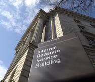This photo taken March 22, 2013, shows the exterior of the Internal Revenue Service (IRS) building in Washington. The IRS issued $4 billion in fraudulent tax refunds last year to people using stolen identities, with some of the money going to addresses in Bulgaria, Lithuania and Ireland, according to a Treasury report released Thursday. The IRS sent a total of 655 tax refunds to a single address in Lithuania, and 343 refunds went to a lone address in Shanghai. (AP Photo/Susan Walsh)