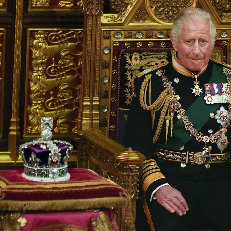 Prince Charles is seated next to the Queen's crown during the State Opening of Parliament, at the Palace of Westminster in London, May 10, 2022. Queen Elizabeth II did not attend the opening of Parliament amid ongoing mobility issues. Prince Charles has been preparing for the crown his entire life. Now, that moment has finally arrived. Charles, the oldest person to ever assume the British throne, became king on Thursday Sept. 8, 2022, following the death of his mother, Queen Elizabeth II. (AP Photo/Alastair Grant, Pool, File)
