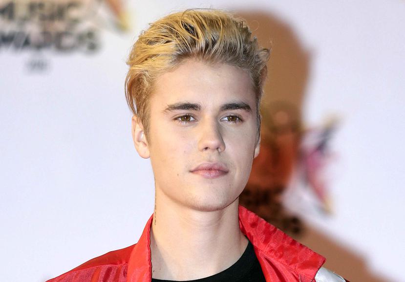 Justin Bieber golpeó accidentalmente a un fotógrafo, quien tuvo que ser atendido en un hospital. (AP)