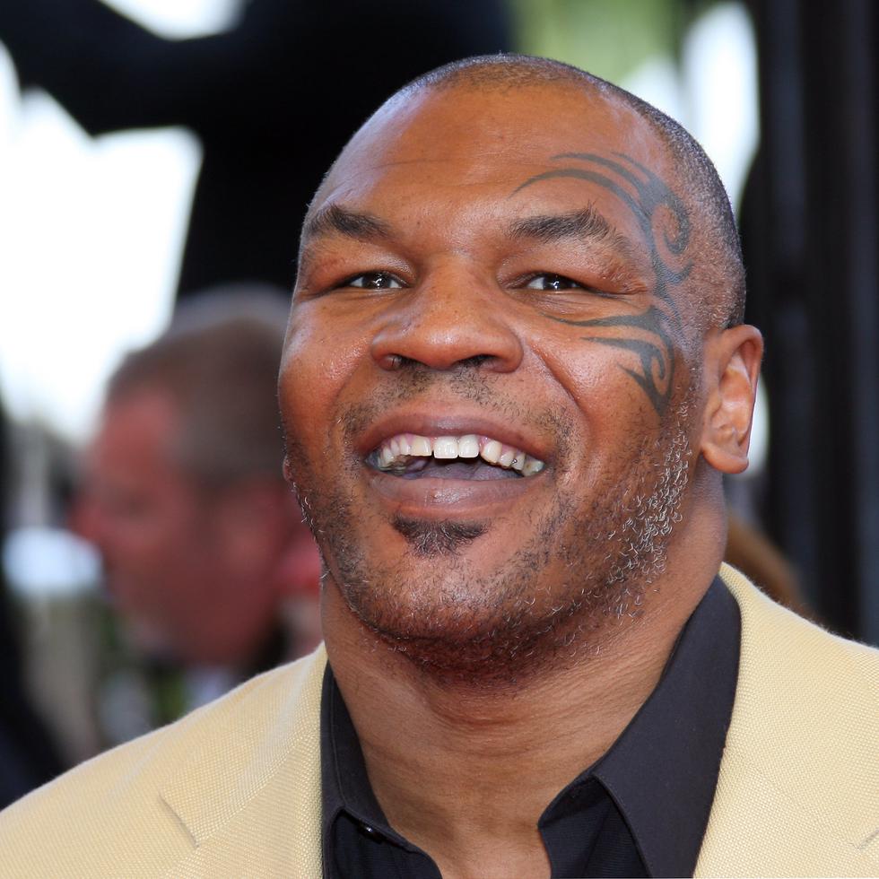Former US boxing champion Mike Tyson poses as he arrives to attend the screening of US director Steven Soderbergh's film 'Che' at the 61st Cannes International Film Festival on May 21, 2008 in Cannes, southern France. The May 14-25 festival winds up with the awards ceremony for the prestigious Palme d'Or, to be determined by a jury headed by Hollywood "bad boy" Sean Penn.    
 AFP PHOTO / VALERY HACHE
