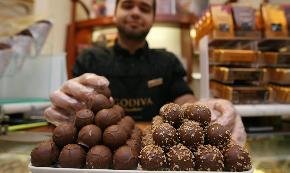 Godiva is closing its only store in Puerto Rico and another 127 in the United States