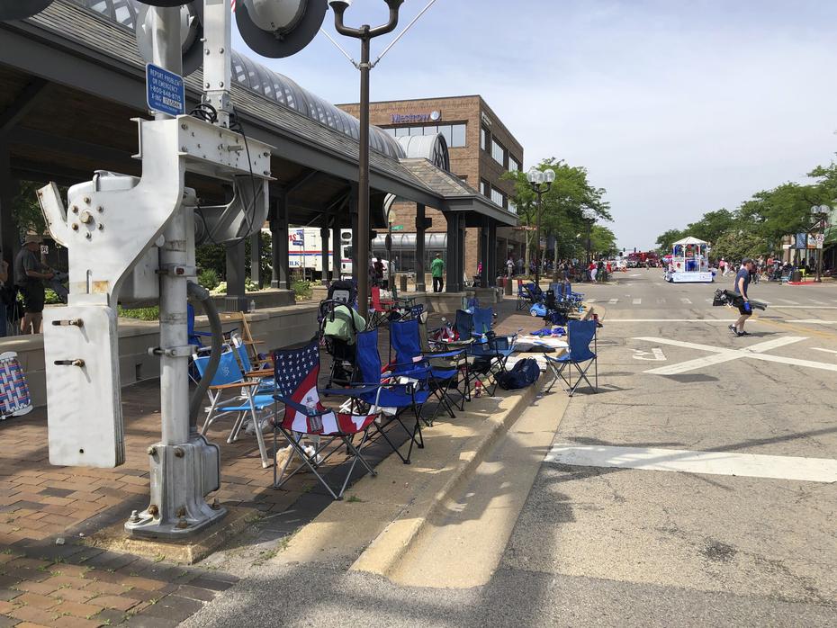 Hundreds of parade goers, some visibly bloodied, fled the parade route, leaving behind chairs, strollers and blankets.