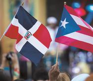 La mayoría de los inmigrantes en Puerto Rico  proviene de la vecina República Dominicana. En la foto, las banderas de  ambos países. (GFR Media)