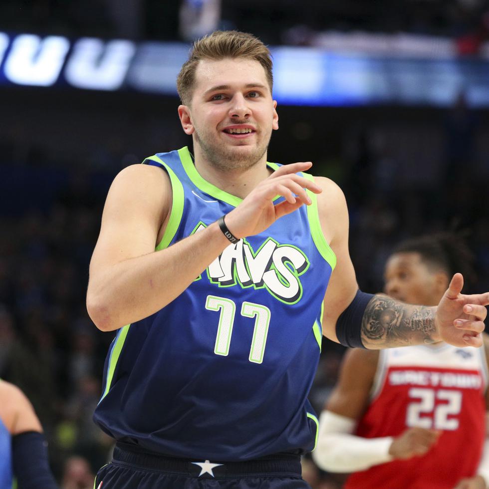 Dallas Mavericks forward Luka Doncic (77) reacts after hitting a three-pointer in the second half against the Sacramento Kings in an NBA basketball game Sunday, Dec. 8, 2019, in Dallas. (AP Photo/Richard W. Rodriguez)