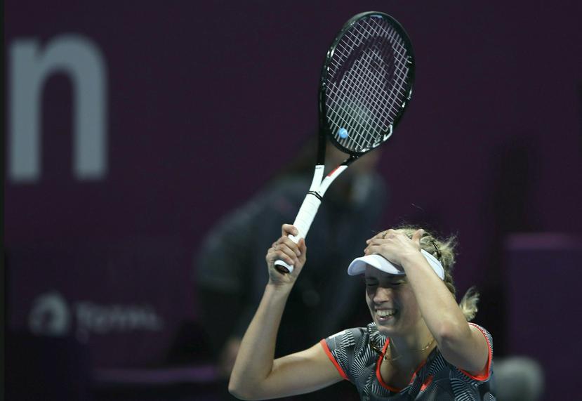 La belga Elise Mertens festeja su triunfo sobre la rumana Simona Halep en la final del Abierto de Qatar por 3-6, 6-4, 6-3, en Doha, Qatar, sábado 16 de febrero de 2019. (AP/Kamran Jebreili)