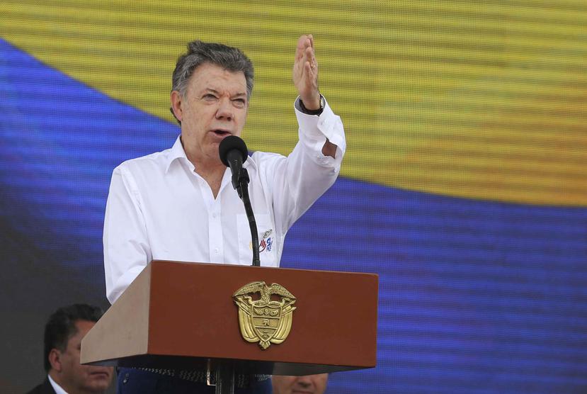 "Ustedes le van a dar el sello de legitimidad a este proceso", dijo el presidente colombiano Juan Manuel Santos. (AP)