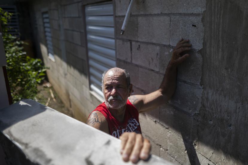 Ángel Tirado outside his home which he rebuilt after Hurricane Maria with less than 15, 000 dollars of government aid.
