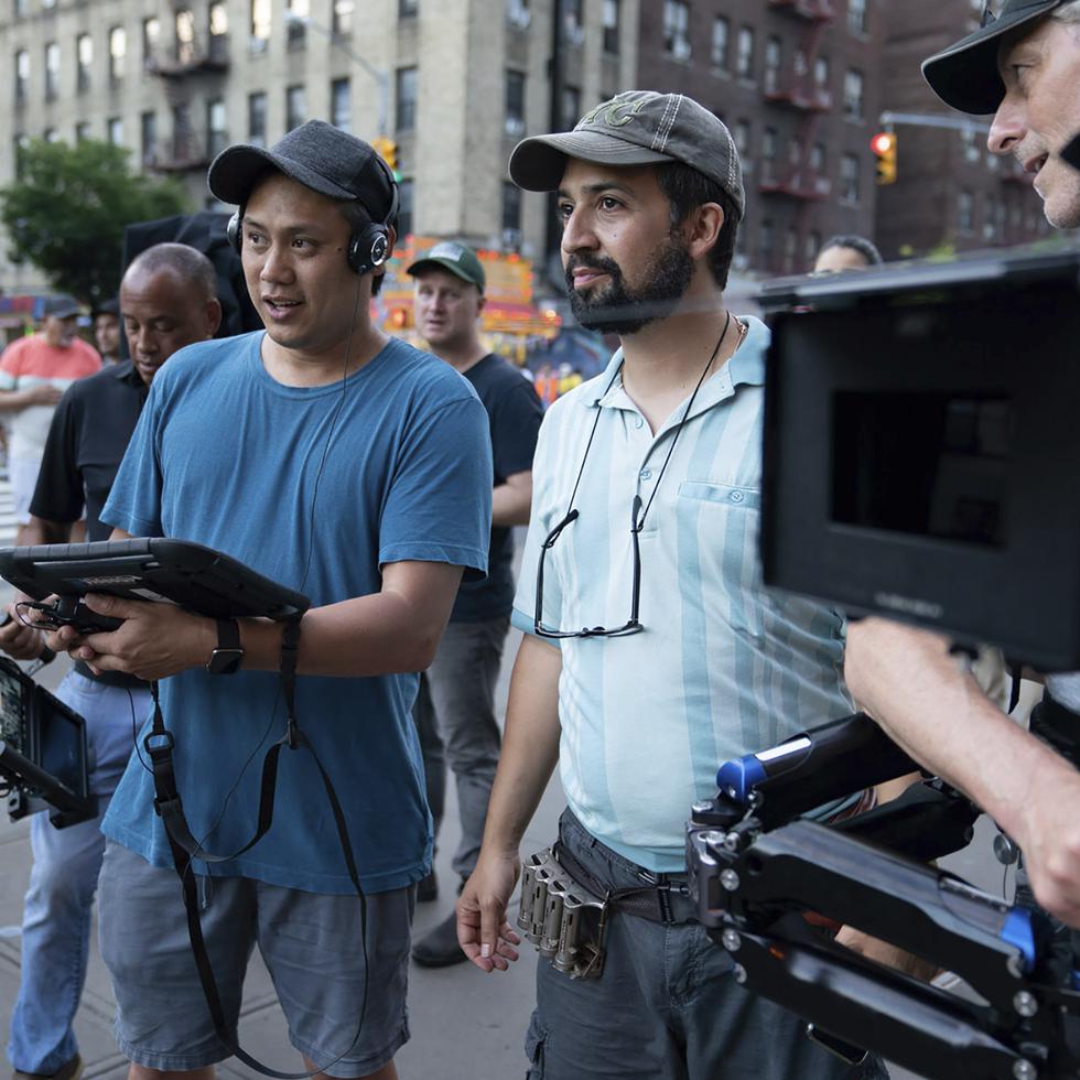 This image released by Warner Bros. Picures shows director Jon M. Chu, left, and Lin-Manuel Miranda on the set of "In the Heights," which will open the Tribeca Film Festival in June. (Macall Polay/Warner Bros. Entertainment via AP)