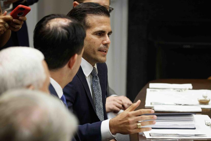 Ricardo Rossello speaks to President Donald Trump during a lunch with governors in the Roosevelt Room of the White House. (AP)