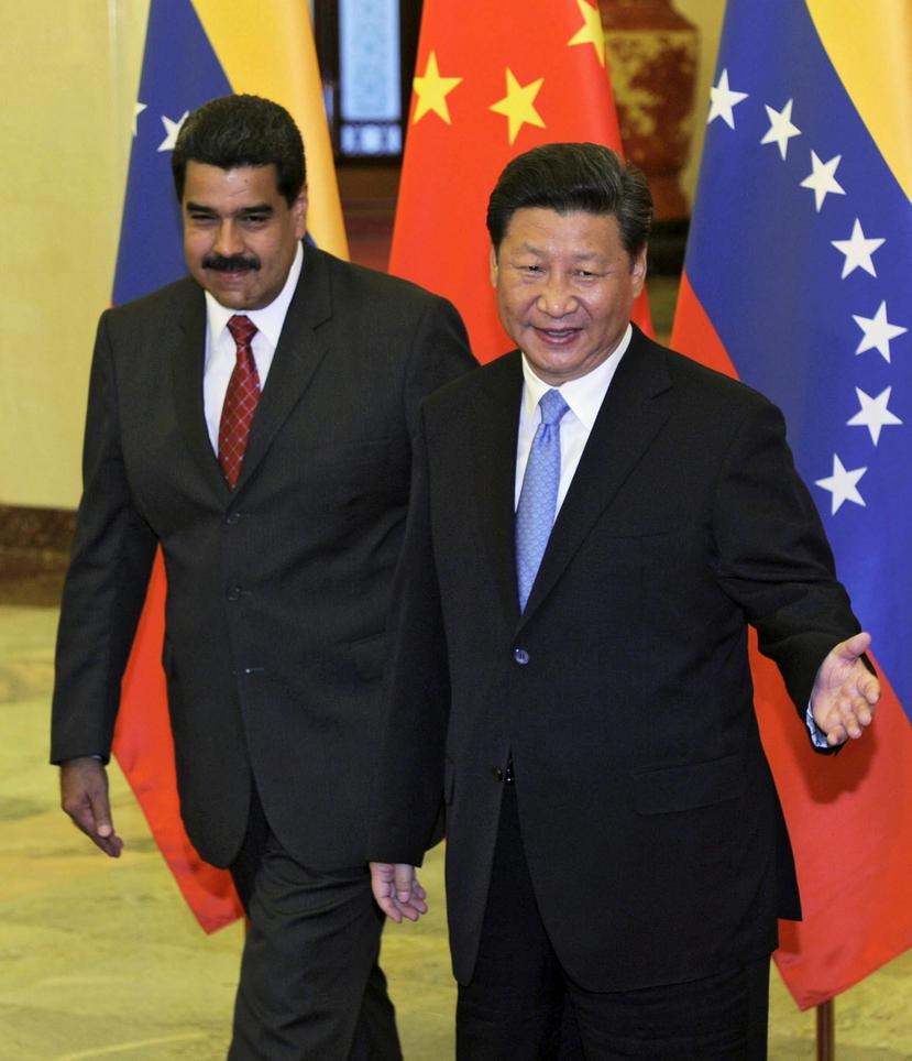 Maduro, que trató esos acuerdos en la reunión con su homólogo chino, Xi Jinping, ayer, presidió hoy la firma oficial durante la clausura de un foro bilateral. (EFE)