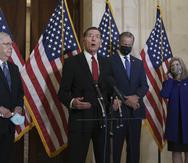 John Barrasso, center, has said that the Democratic Party "has moved far left" with proposals such as making Puerto Rico and Washington D.C. states, while Senate Majority Leader, Republican Mitch McConnell (left), said that both proposals are part of the Democrats' "socialist agenda".