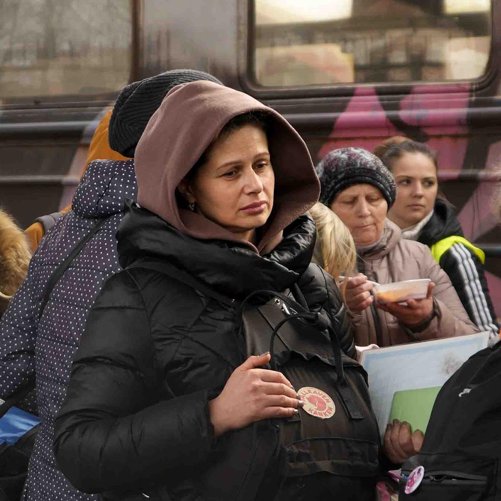 Women, fleeing from Ukraine, stand on a platform at the train station in Przemysl, Poland, Thursday, March 3, 2022. More than 1 million people have fled Ukraine following Russia's invasion in the swiftest refugee exodus in this century, the United Nations said Thursday. (AP Photo/Markus Schreiber)