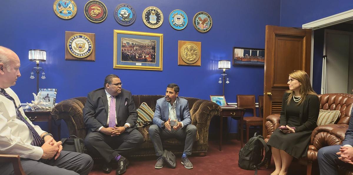 Kenneth Rivera Robles and Luis Pizarro Otero, from the Puerto Rico Chamber of Commerce, meeting in the office of Republican Congressman Vern Buchanan.