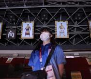 Imágenes de famosos peleadores de sumo adornan el techo del coliseo que se usa para el boxeo olímpico.