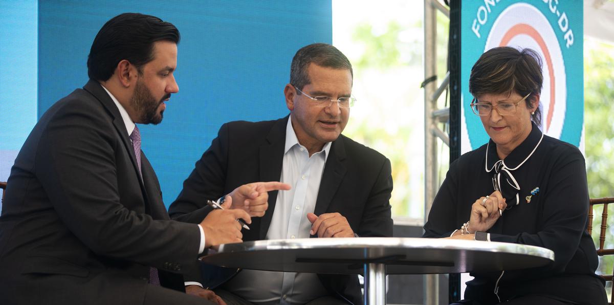 Pedro Pierluisi (center) said yesterday that of that total some $6.654 billion - or 66 percent - is already allocated or destined to a project.