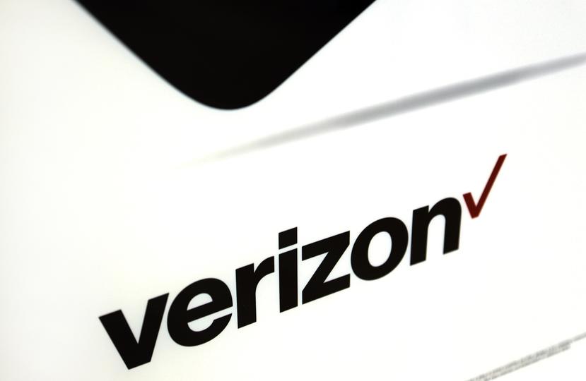 FILE - This Monday, July 25, 2016, file photo shows signage in a Verizon store in North Andover, Mass. Verizon is the latest mobile carrier to bring back unlimited plans, but its version is pricier than offerings from rivals T-Mobile and Sprint. (AP Photo/Elise Amendola, File)