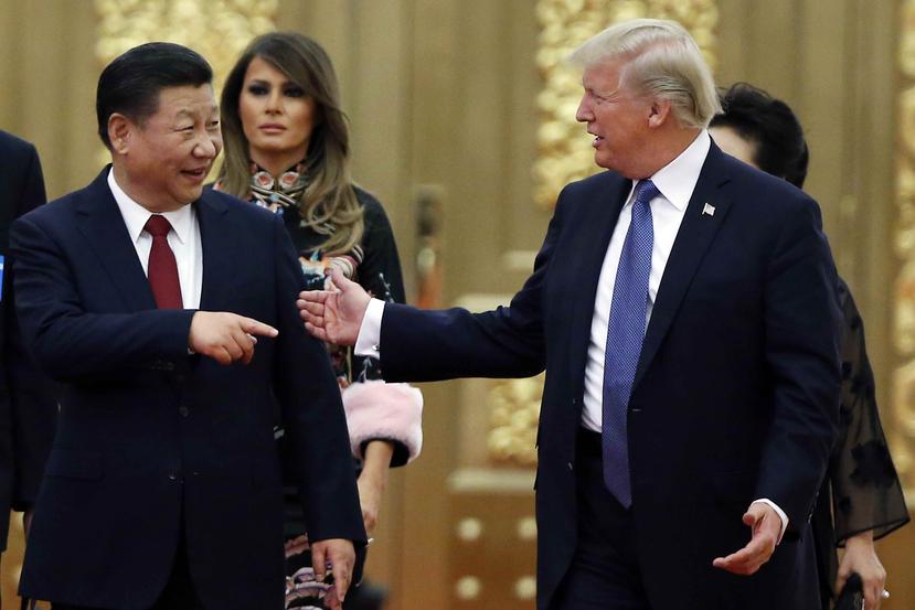 El presidente Donald Trump junto a su homólogo de China, Xi Jinping. (AP)
