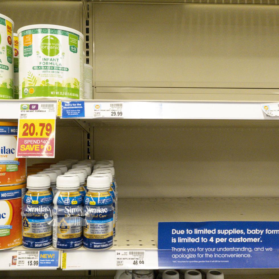 Baby formula is displayed on the shelves of a grocery store with a sign limiting purchases in Indianapolis, Tuesday, May 10, 2022. Parents across the U.S. are scrambling to find baby formula because supply disruptions and a massive safety recall have swept many leading brands off store shelves. (AP Photo/Michael Conroy)