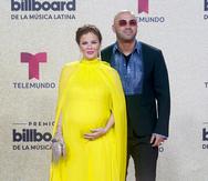 Wisin, right, and Yomaira Ortiz Feliciano arrive at the Billboard Latin Music Awards on Thursday, Sept. 23, 2021, at the Watsco Center in Coral Gables, Fla. (AP Photo/Marta Lavandier)