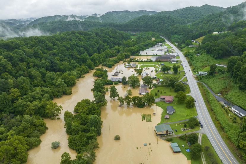 Home and structures are flooded near Quicksand, Ky., Thursday, July 28, 2022. Heavy rains have caused flash flooding and mudslides as storms pound parts of central Appalachia. Kentucky Gov. Andy Beshear says it's some of the worst flooding in state history. (Ryan C. Hermens/Lexington Herald-Leader via AP)