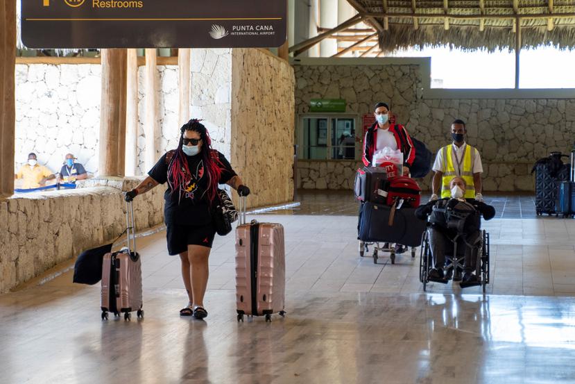 Pasajeros que llegan a Punta Cana, en un vuelto que aterriza en el Aeropuerto Internacional de Punta Cana, en República Dominicana.
