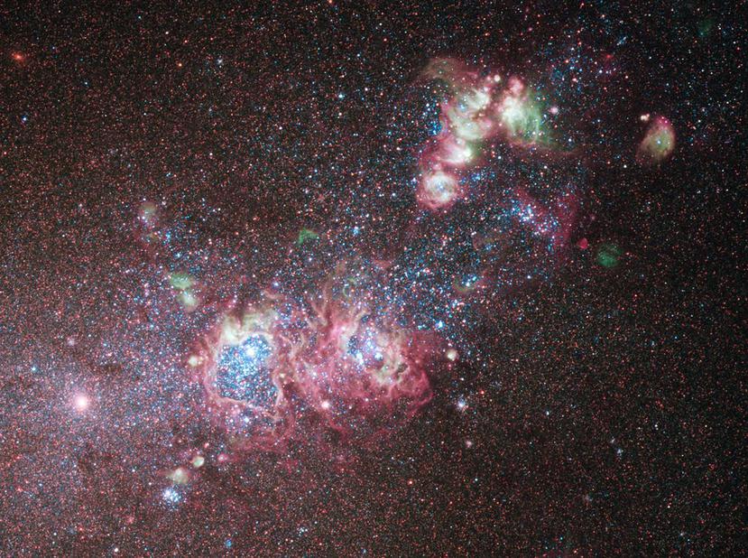 This NASA image released on May 13, 2011 shows the dwarf galaxy NGC 4214  ablaze with young stars and gas clouds. Located around 10 million light-years away in the constellation of Canes Venatici (The Hunting Dogs), the galaxy's close proximity, combined with the wide variety of evolutionary stages among the stars, make it an ideal laboratory to research the triggers of star formation and evolution. This color image was taken using the Hubble Space Telescope's Wide Field Camera 3 in December 2009. AFP PHOTO/NASA/HANDOUT/RESTRICTED TO EDITORIAL USE - MANDATORY CREDIT " AFP PHOTO / - NO MARKETING NO ADVERTISING CAMPAIGNS - DISTRIBUTED AS A SERVICE TO CLIENTS