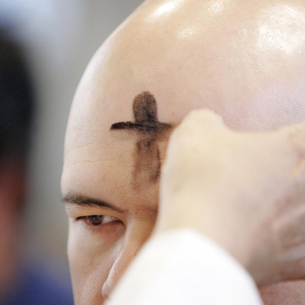 A parishioner is marked with an ash cross on his forehead during an Ash Wednesday service at San Fernando Cathedral in San Antonio, Wednesday, Feb. 21, 2007. In the western Christian calendar, Ash Wednesday marks the start of Lent.   (AP Photo/Eric Gay)