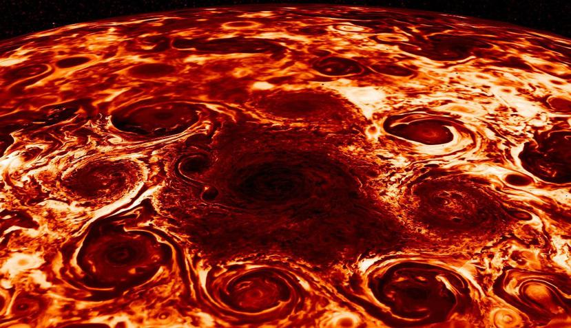 Fotografía facilitada por la NASA de los ciclones gigantes que sus científicos responsables de la misión Juno han encontrado en el polo norte de Júpiter (EFE).