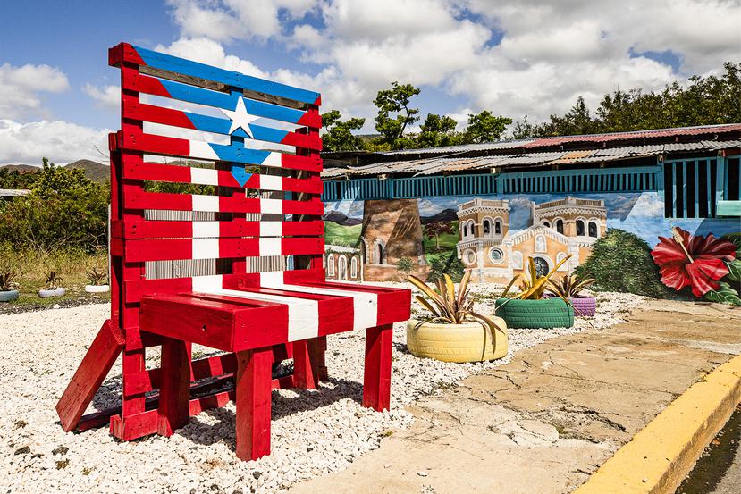 Colorful kiosk and giant chair painted with the Puerto Rican flag.