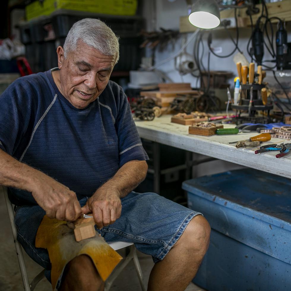 Wilzen “Cuco” Pérez, an artisan from Guánica who carves the Three Wise Men and Saints out of wood in his workshop.