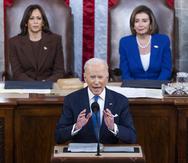 President Joe Biden delivers his first State of the Union address to a joint session of Congress at the Capitol, Tuesday, March 1, 2022, in Washington as Vice President Kamala Harris and House speaker Nancy Pelosi of Calif., look on. (Jim Lo Scalzo/Pool via AP)