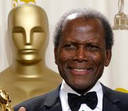 FILE - Sidney Poitier poses with his honorary Oscar during the 74th annual Academy Awards on March 24, 2002, in Los Angeles.  Poitier, the groundbreaking actor and enduring inspiration who transformed how Black people were portrayed on screen, became the first Black actor to win an Academy Award for best lead performance and the first to be a top box-office draw, died Thursday, Jan. 6, 2022 in the Bahamas. He was 94. (AP Photo/Doug Mills, File)