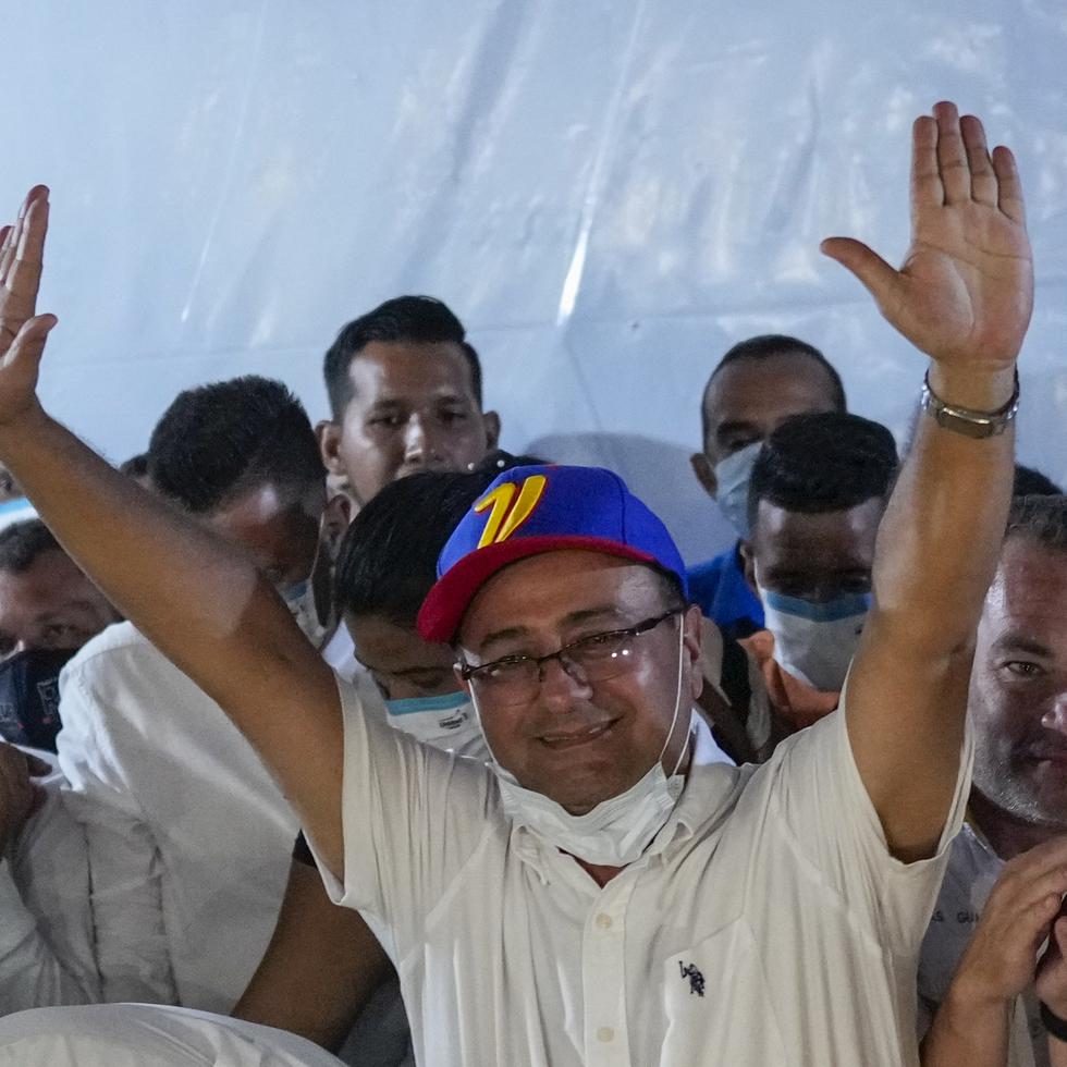 Opposition candidate Sergio Garrido celebrates after ruling party candidate Jorge Arreaza admitted on social media his defeat in a governor election re-run in Barinas, Venezuela, Sunday, Jan. 9, 2022. Voters in the home state of Venezuela's late President Hugo Chávez chose Garrido for governor in a special election called after the contender representing that faction in November's regular contest was retroactively disqualified as he was ahead in the vote count (AP Photo/Matias Delacroix)