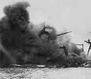 This US Navy file iamge shows The USS Arizona afire and sinking after the Japanese attack on Pearl Harbor on December 7, 1941. December 7, 2008 marks the 67th anniversary of the attack which drew the US into WWII. AFP PHOTO/HO/US Navy