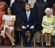 El príncipe Harry, Meghan Markle y la reina Elizabeth II.  (Foto: Archivo)