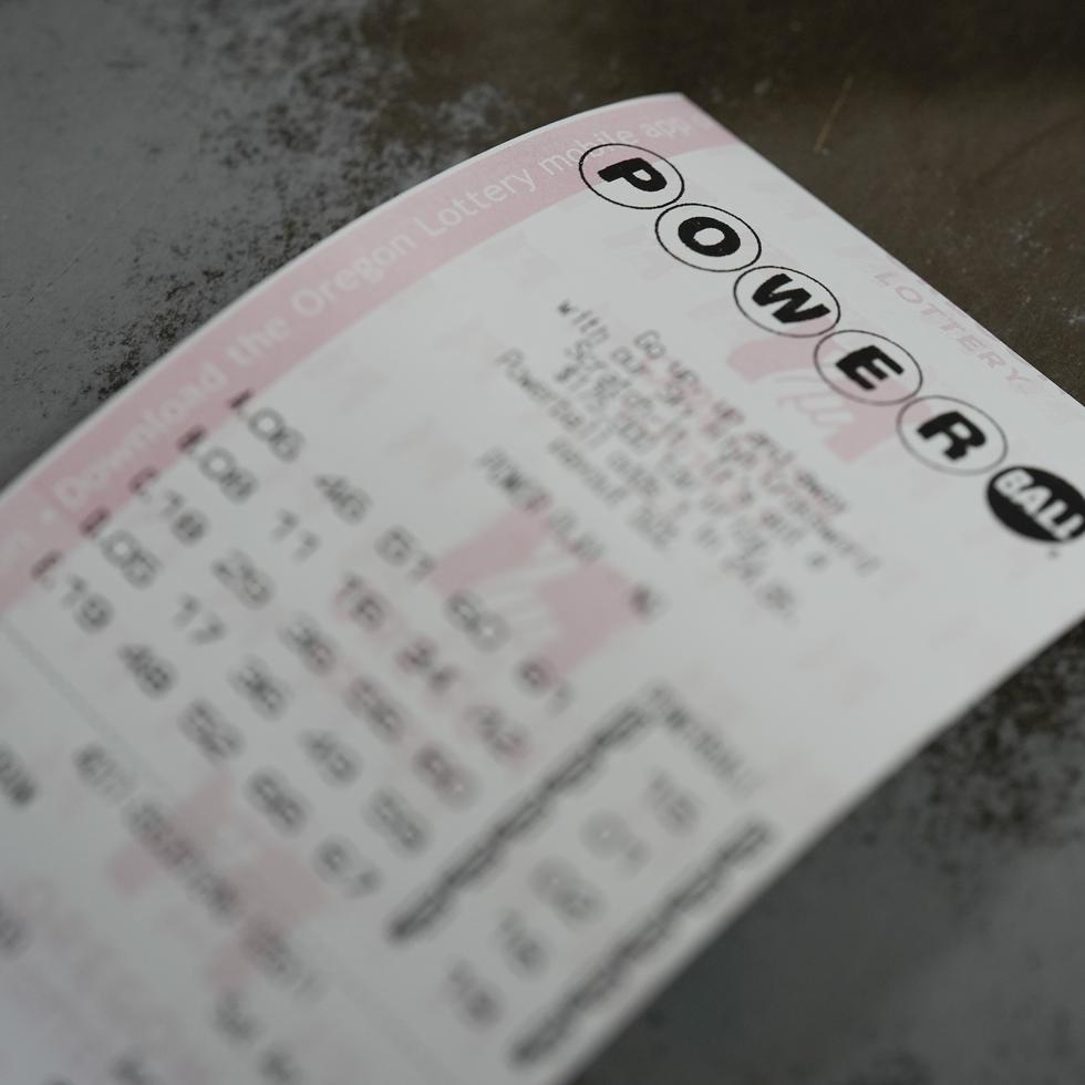 A Powerball ticket is seen at a 7-Eleven on Friday, April 5, 2024, in Portland, Ore. The ticket did not win the jackpot. (AP Photo/Jenny Kane)