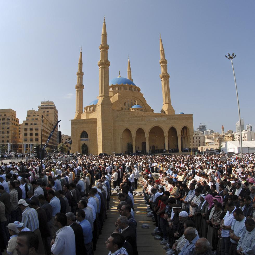 Lebanese people perform Friday first prayer in front of the Mohammed al-Amin Mosque in downtown Beirut, Lebanon, Friday, Oct. 17, 2008. The Mosque was built by slain Prime Minister Rafik Hariri and after was buried in a grave site adjacent to the Mosque. (AP Photo/Mahmoud Tawil)