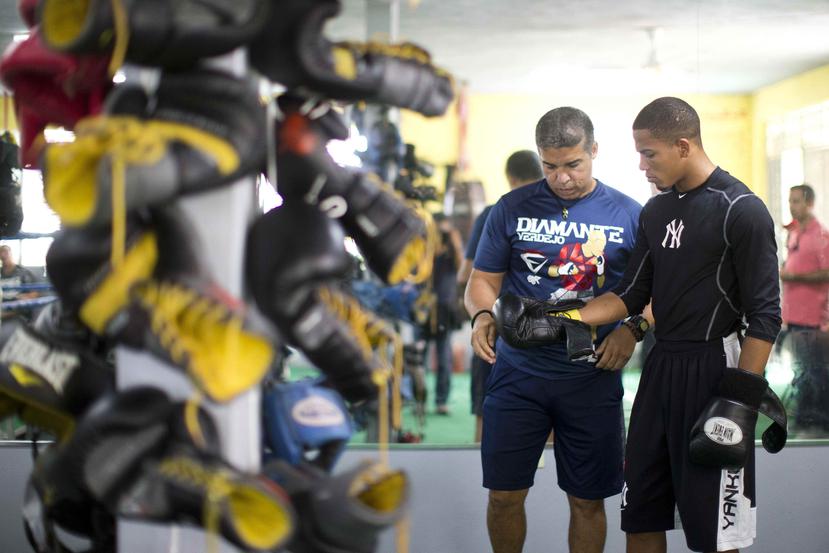 Ricky Márquez y Félix Verdejo han trabajado juntos desde los inicios del boxeador. (Archivo / tonito.zayas@gfrmedia.com)