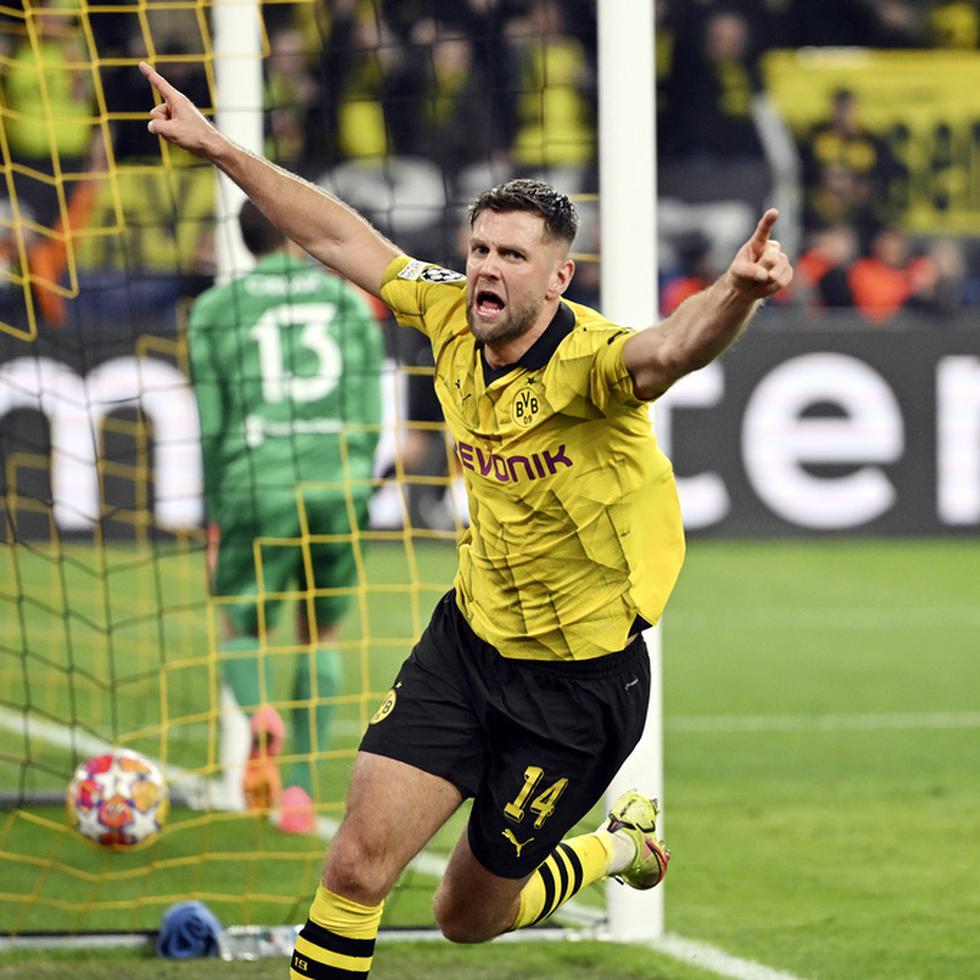 Niclas Fuellkrug del Borussia Dortmund celebra tras anotar el tercer gol de su equipo en el duelo de vuelta de los cuartos de final de la Liga de Campeones ante el Atlético de Madrid.
