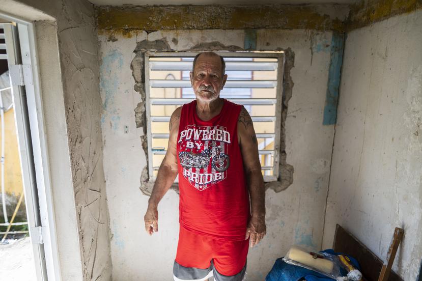 Ángel Tirado standing in a part of the house he built with his own hands on July 27, 2022.  
