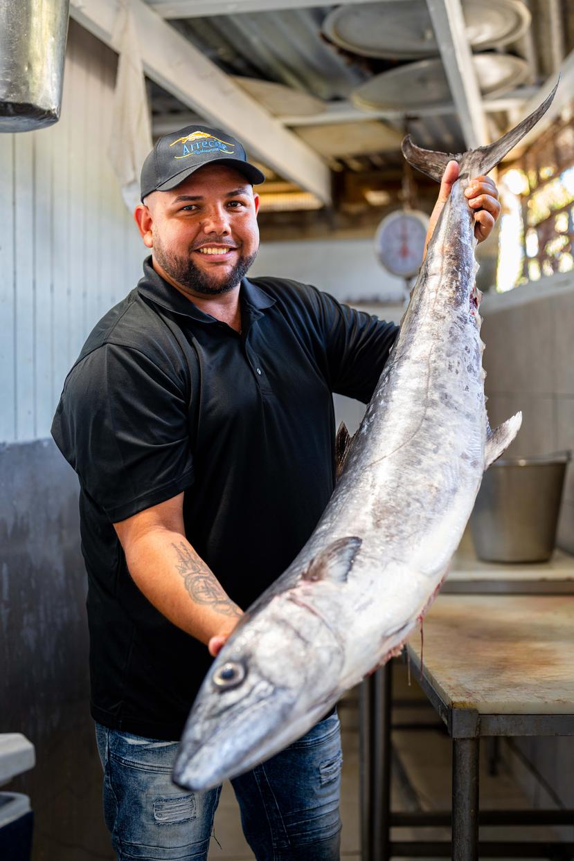 Ryan Reillo, owner of Arrecife restaurant, shows off a fresh mackerel. 