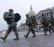 National Guard soldiers walk out of the U.S. Capitol, Saturday, Jan. 16, 2021, in Washington, as security is increased ahead of the inauguration of President-elect Joe Biden and Vice President-elect Kamala Harris. (AP Photo/Jacquelyn Martin)