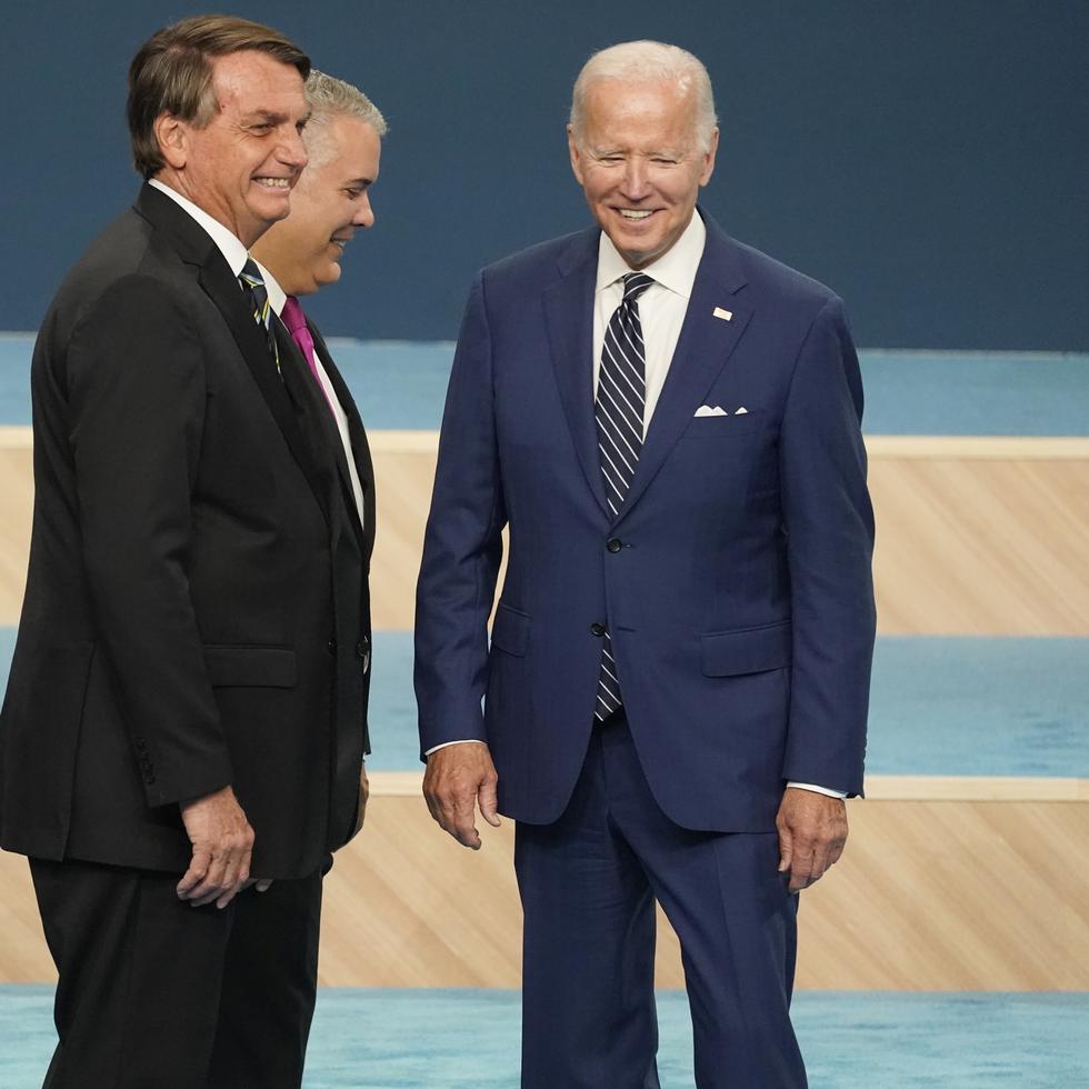 From left, Argentinian President Alberto Fernandez, Brazilian President Jair Bolsonaro, Colombian President Ivan Duque and President Joe Biden walk off stage after participating in a family photo with heads of delegations at the Summit of the Americas, Friday, June 10, 2022, in Los Angeles. (AP Photo/Marcio Jose Sanchez)