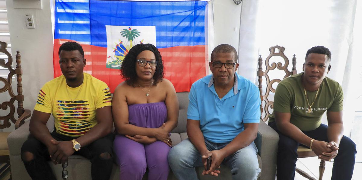 Relatives of a 23 year-old Haitian woman who perished at sea.