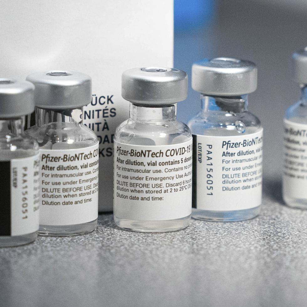 Vials of the Pfizer-BioNtech COVID-19 vaccine, each containing five doses, sit on a table Wednesday, Dec. 16, 2020, during a vaccine clinic at Providence Alaska Medical Center in Anchorage, Alaska.