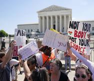 People protest about abortion outside the Supreme Court in Washington, Saturday, June 25, 2022. The Supreme Court has ended constitutional protections for abortion that had been in place nearly 50 years, a decision by its conservative majority to overturn the court's landmark abortion cases. (AP Photo/Steve Helber)