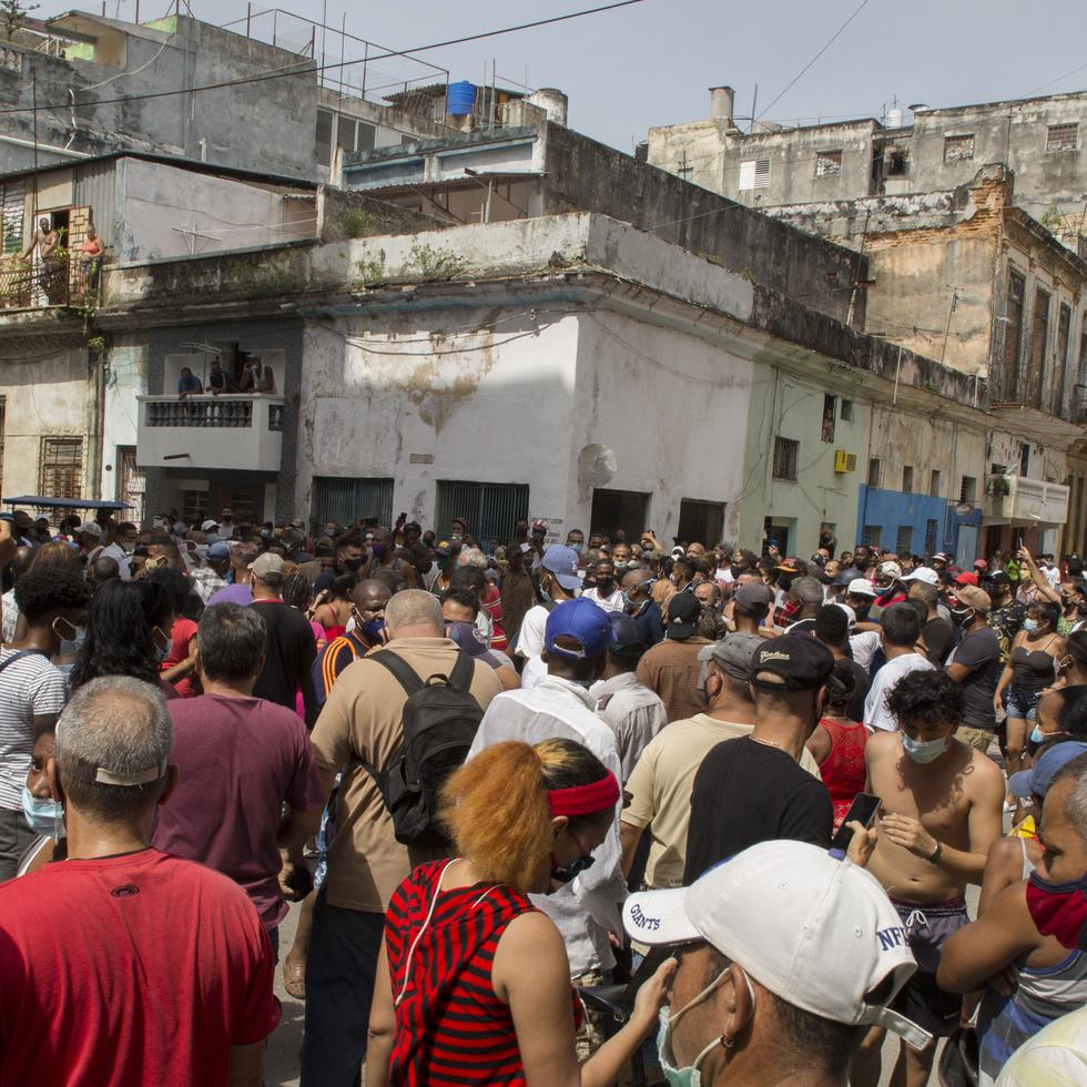 A anti-government protesters march in Havana, Cuba, Sunday, July 11, 2021. Hundreds of demonstrators went out to the streets in several cities in Cuba to protest against ongoing food shortages and high prices of foodstuffs. (AP Photo/Ismael Francisco)