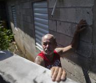 Ángel Tirado outside his home which he rebuilt after Hurricane Maria with less than 15, 000 dollars of government aid.