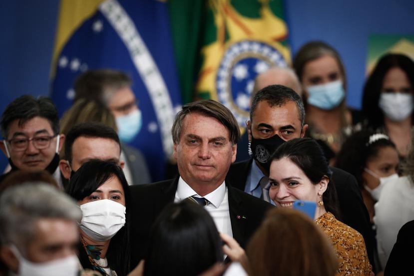 Jair Bolsonaro, al centro, ha minimizado los efectos del coronavirus desde el inicio de la pandemia.